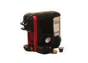 A black and red coffee capsule machine with a cup of coffee and capsules placed in front of it.