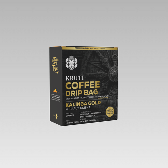 A packaged product labeled 'KRUTI COFFEE DRIP BAG KALINGA GOLD' with text indicating it is a blend of Koraput coffee, washed process, and medium dark roast.