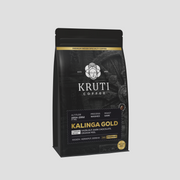 A package of Kruti Coffee Kalinga Gold, a premium dark roasted coffee blend in a 250g bag.
