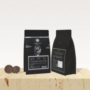 Kruti Coffee Silver Tribes Packet displaye don a Beige Color Platform & White Color Background