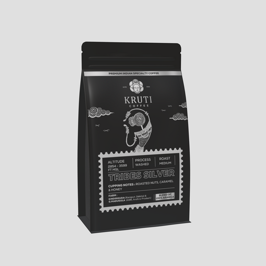 A package of Kruti Coffee Tribes Silver, a signature blend of washed Arabica coffee, showing the brand logo, product name, and cupping notes.